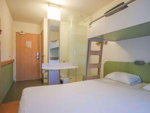 Postel nebo postele na pokoji v ubytování ibis budget Toulouse Aeroport
