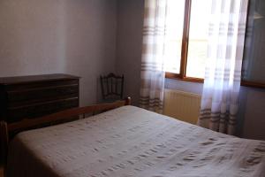 Postel nebo postele na pokoji v ubytování Les Louchardes