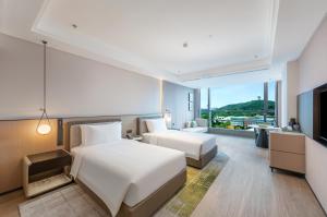 Fotografie z fotogalerie ubytování Nanjing Yangzi River Conference Center Longshan Lake Hotel v destinaci Nan-ťing + 37 fotografií
