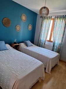 Postel nebo postele na pokoji v ubytování Les Louchardes