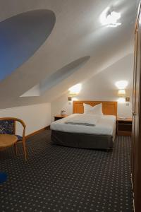 Postel nebo postele na pokoji v ubytování Hotel Alekto