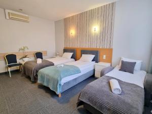 Postel nebo postele na pokoji v ubytování Hotel Orbita + 37 fotografií