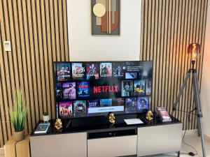 a flat screen tv sitting on top of a desk at Panoramic view, perfect between sea and mountain in Mandelieu-La Napoule