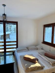 Postel nebo postele na pokoji v ubytování Winter Holiday Home TT