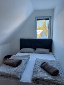 Postel nebo postele na pokoji v ubytování Winter Holiday Home TT