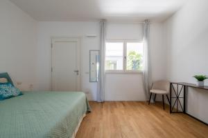 Postel nebo postele na pokoji v ubytování Loft Mare Seafront Modern Stay