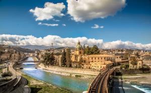 a view of a city with a river and buildings at Montesanto 25 in Cosenza