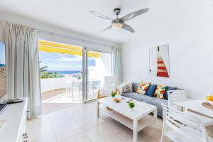 a living room with a couch and a table at Nueva S 523 by VillaGranCanaria in San Agustin