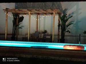 a view of a swimming pool in a living room at Casa El Veranito in Chiclana de la Frontera