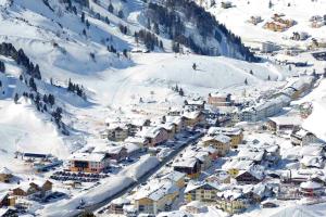 a small town covered in snow on a mountain at Fewo-Obertauern Maisonette in Obertauern