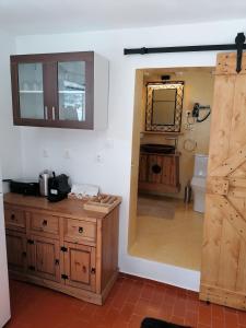 a bathroom with a sink and a toilet and a mirror at Stephany's Skyline Studio in Parikia