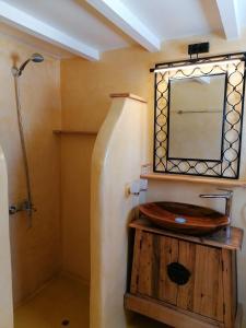 a bathroom with a wooden sink and a mirror at Stephany's Skyline Studio in Parikia +15 photos