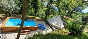 an overhead view of a tent and a swimming pool at Bell-tenten Quinta Pomar Do Pontido in Cabeceiras de Basto