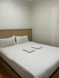 Katil atau katil-katil dalam bilik di Mint Hotel