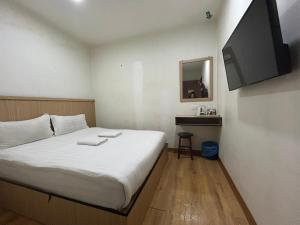 Katil atau katil-katil dalam bilik di Mint Hotel