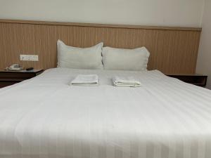 Katil atau katil-katil dalam bilik di Mint Hotel