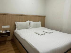 Katil atau katil-katil dalam bilik di Mint Hotel
