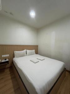 Katil atau katil-katil dalam bilik di Mint Hotel