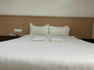 Katil atau katil-katil dalam bilik di Mint Hotel