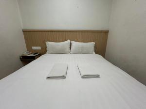 Katil atau katil-katil dalam bilik di Mint Hotel