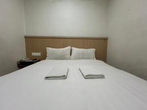 Katil atau katil-katil dalam bilik di Mint Hotel