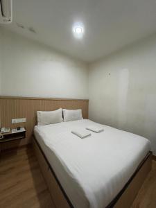 Katil atau katil-katil dalam bilik di Mint Hotel