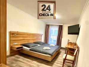 Postel nebo postele na pokoji v ubytování Hotel Kennedy