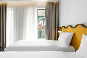 Postel nebo postele na pokoji v ubytování ibis Styles Old Tbilisi