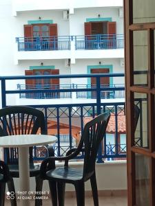 a table and chairs in front of a balcony at George Studios Stalis in Stalís +53 photos