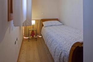 Postel nebo postele na pokoji v ubytování Le Zitelle di Ron