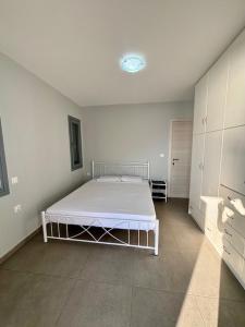 Postel nebo postele na pokoji v ubytování Three Olive Homes