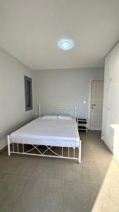 Postel nebo postele na pokoji v ubytování Three Olive Homes