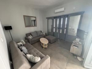Posezení v ubytování Three Olive Homes