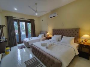 Postel nebo postele na pokoji v ubytování Villa Infinity Negombo