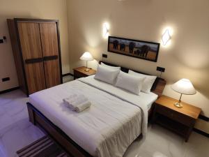 Postel nebo postele na pokoji v ubytování Villa Infinity Negombo