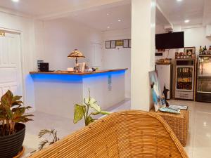 a room with a counter and a blue bar at La Sirenne Inn in El Nido