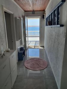 a hallway with a view of the ocean from a house at Kuća za odmor SeaHouse in Karlobag