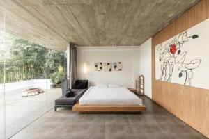 Postel nebo postele na pokoji v ubytování Villa C5 KQH Viện Nghiên Cứu Hạt Nhân