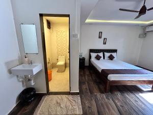 Postel nebo postele na pokoji v ubytování Aqua Bliss Beach Resort