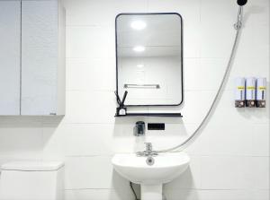 a bathroom with a sink and a mirror at Bongbong stay in Seoul +43 photos