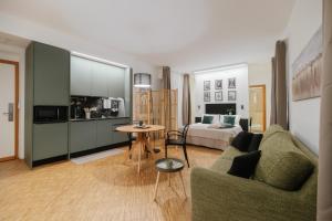 a living room with a couch and a table at Residence Degli Aranci - Casêta in Ancona