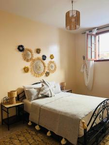 Ένα ή περισσότερα κρεβάτια σε δωμάτιο στο Appartement a 4 Minutes de la plage