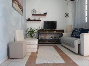 TV a/nebo společenská místnost v ubytování Apartamento aconchegante