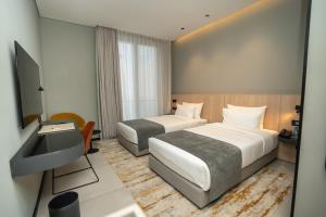 Sama Hotels客房内的一张或多张床位