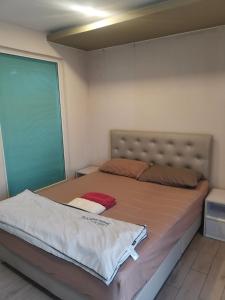 Postel nebo postele na pokoji v ubytování 芭提雅网红公寓七海一期