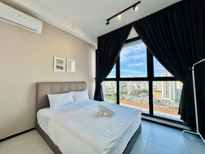 a bedroom with a large bed and a large window at a29 seaview luxury 3BR-10PAX URBAN NETFLIX in Jelutong +61 photos