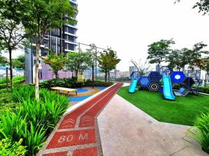 a playground in a park with a bench at a29 seaview luxury 3BR-10PAX URBAN NETFLIX in Jelutong