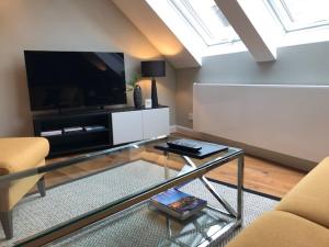 TV a/nebo společenská místnost v ubytování Boutique-Hotel Moseltor