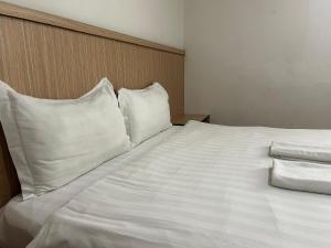 Katil atau katil-katil dalam bilik di Mint Hotel