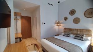 Łóżko lub łóżka w pokoju w obiekcie Casa du Soleil Hostal Boutique